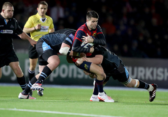 Conor Murray tackled by Jonny Gray and Zander Fagerson