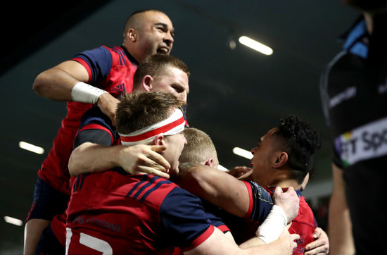 Francis Saili celebrates his try with teammates