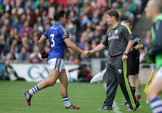 Eamonn Fitzmaurice greets Aidan O'Mahony as he leaves the field