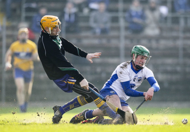 Billy Nolan shoots under pressure from Patrick Kelly