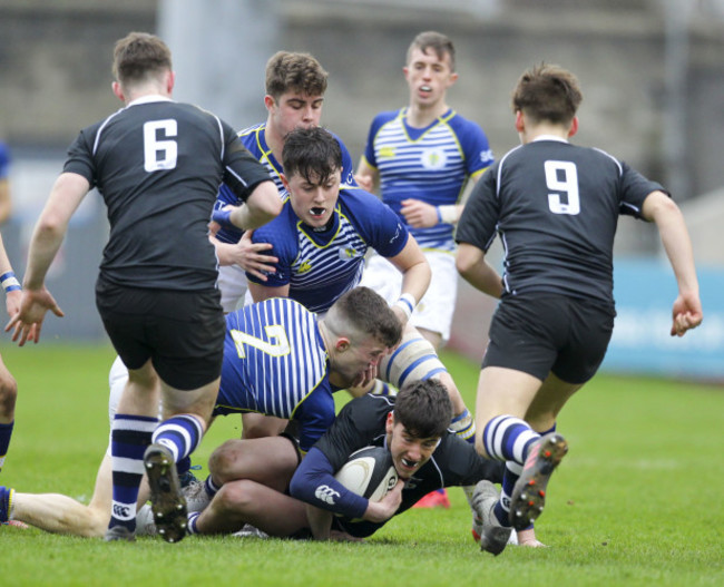 Michael Fenton is tackled by Derry Gleeson