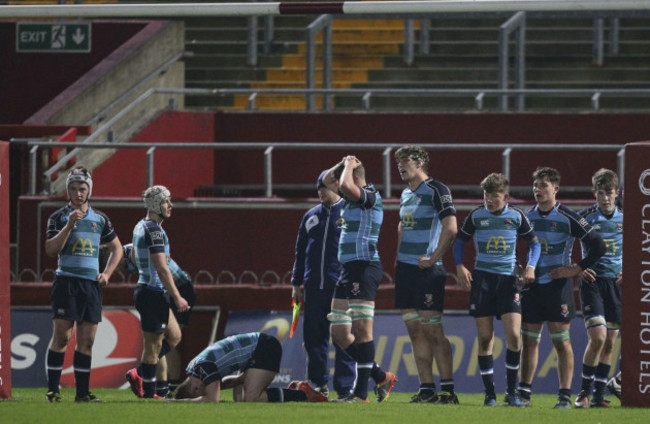 Castletroy players are dejected after conceding a final minute try