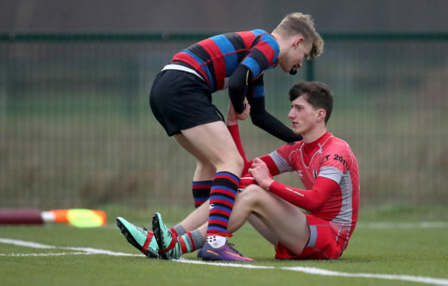 Ewan O'Brien consoles Ruairi Woodcock after the game