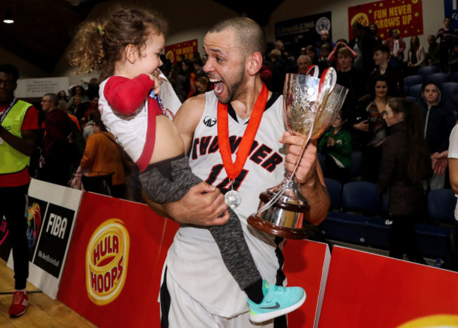 Isaac Westbrooks celebrates after the game with his daughter Eabha