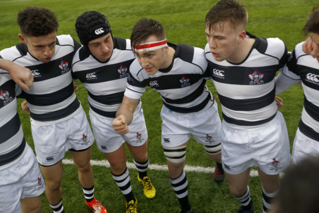 Max Kearney speaks with his team before kick-off