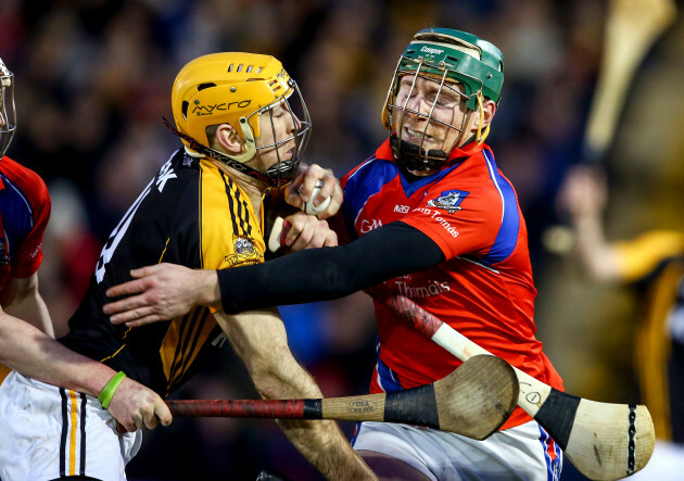 Gary Brennan is tackled by Shane Cooney