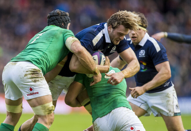 Sean O'Brien and Iain Henderson tackle Richie Gray