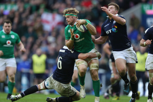 Ireland&rsquo;s Jamie Heaslip is tackled by Scotland&rsquo;s Ryan Wilson and Huw Jones