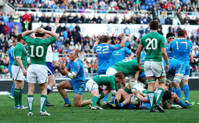 Paddy Jackson looks on dejected as Sergio Parisse celebrates