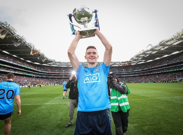 Brian Fenton celebrates with the trophy after the game