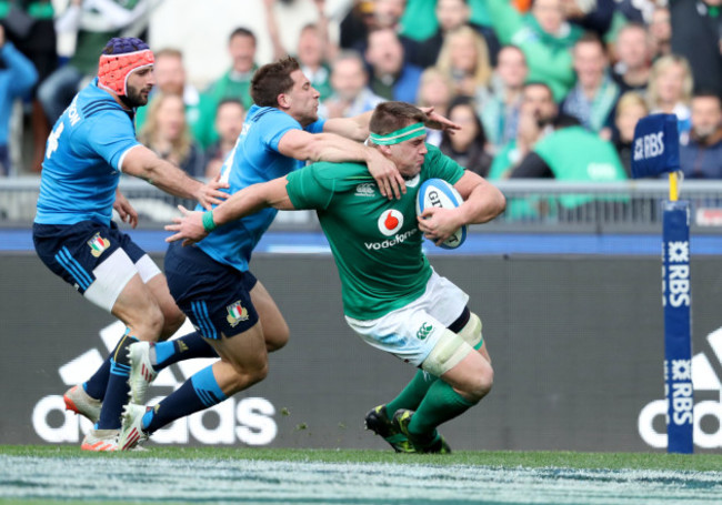 CJ Stander scores their fifth try despite Tommaso Benvenuti and Angelo Esposito