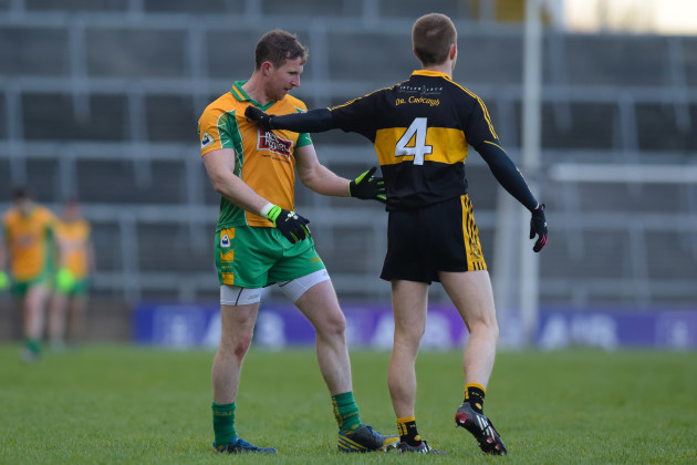 Gary Sice and Fionn Fitzgerald tussle at the throw-in