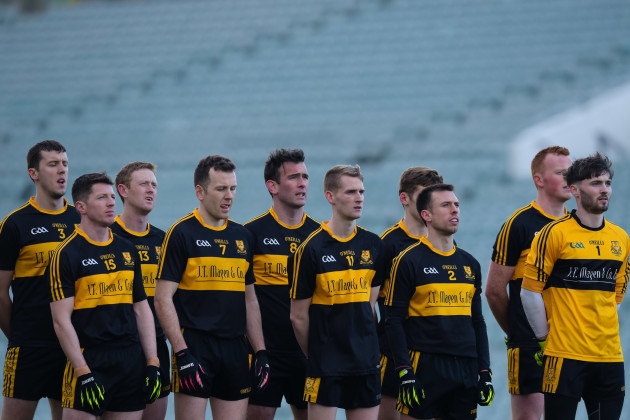 Dr. Crokes players stand for the national anthem