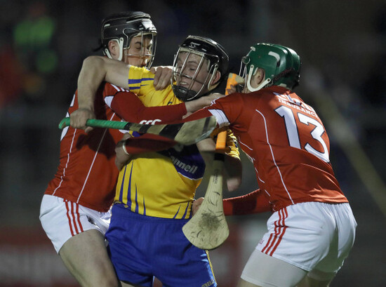 Darragh Fitzgibbon and Alan Cadogan tackle Jack Browne