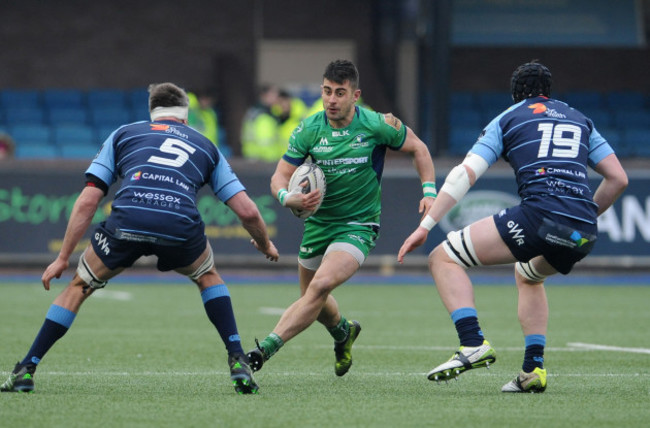 Tiernan O'Halloran is tackled by James Down and Seb Davies