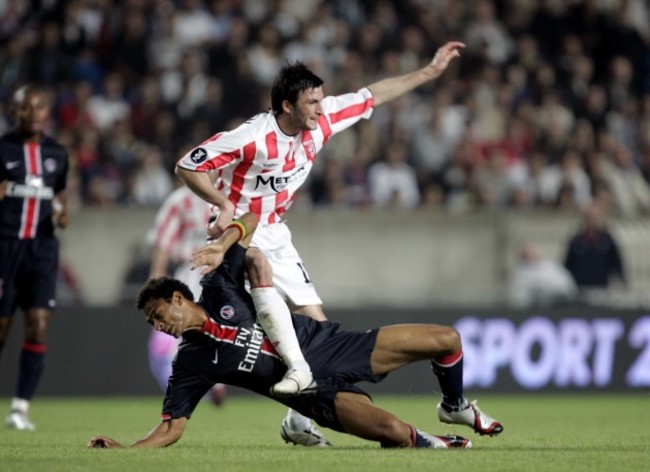 Edouard Cisse of PSG tackles Killian Brennan of Derry