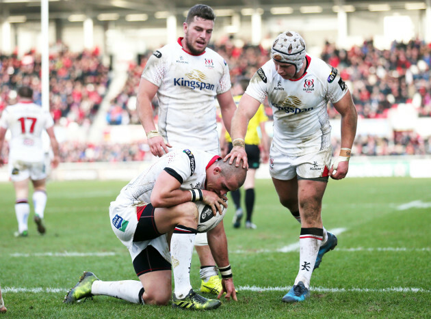 Ruan Pienaar celebrates his try with Luke Marshall  and Sean Reidy