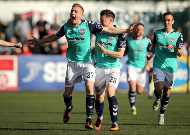 Ronan Cutis celebrates scoring their second goal of the game with Conor McDermott