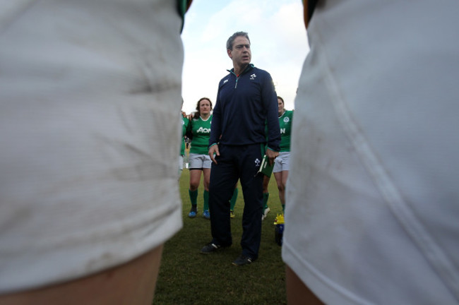 Tom Tierney speaks to his players after the game