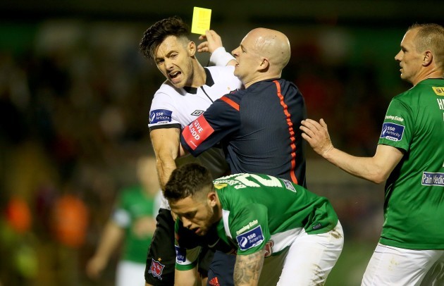 Richie Towell is held back by Rob Rogers