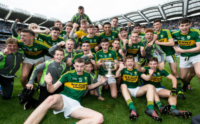 Kerry players celebrate with the cup after the game