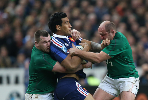 Sébastien Vahaamahina is tackled by Cian Healy and Rory Best
