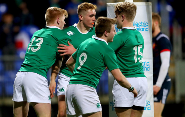 Tommy O’Brien celebrates scoring his sides second try with Jordan Larmour, Jonny Stewart and Robert Lyttle