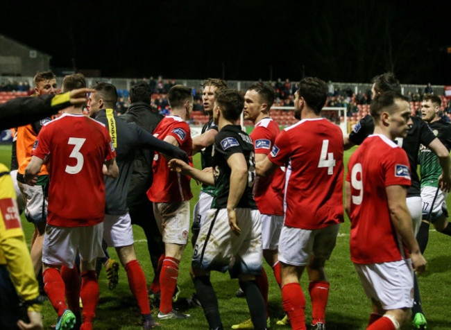 Players from both sides get involved in scuffles during the closing stages of the game