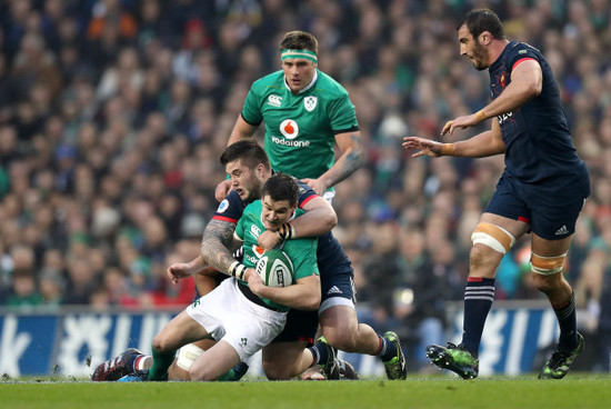 Johnny Sexton is tackled by Cyril Baille