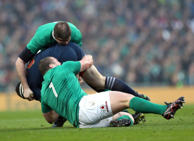 Donnacha Ryan and Jack McGrath tackle Guilhem Guirado