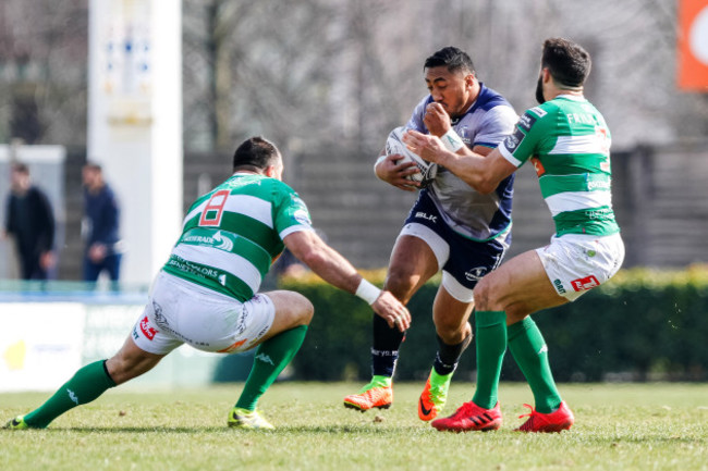 Bundee Aki is tackled by Robert Barbieri and Tito Tebaldi