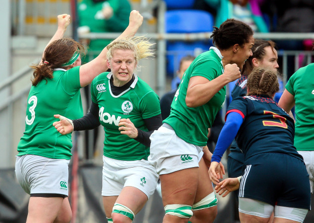 Claire Molloy, Ailis Egan and Sophie Spence celebrate Leah Lyons scoring a try