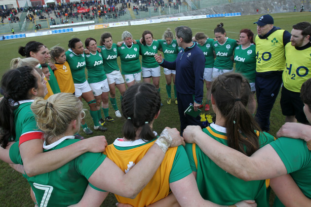 Tom Tierney speaks to his players after the game