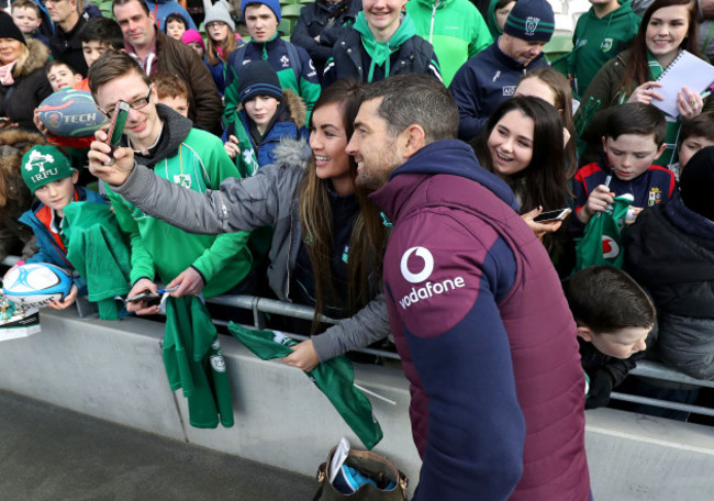 Rob Kearney poses for a photo with a fan