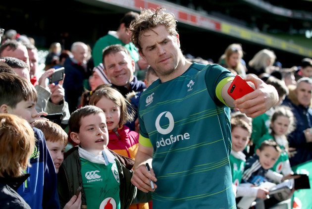 Jamie Heaslip poses for pictures with fans
