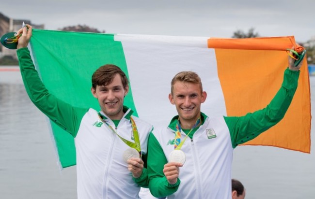 Gary and Paul O'Donovan celebrate winning a silver medal