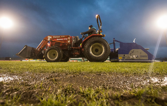 Work is done on the pitch ahead of the game