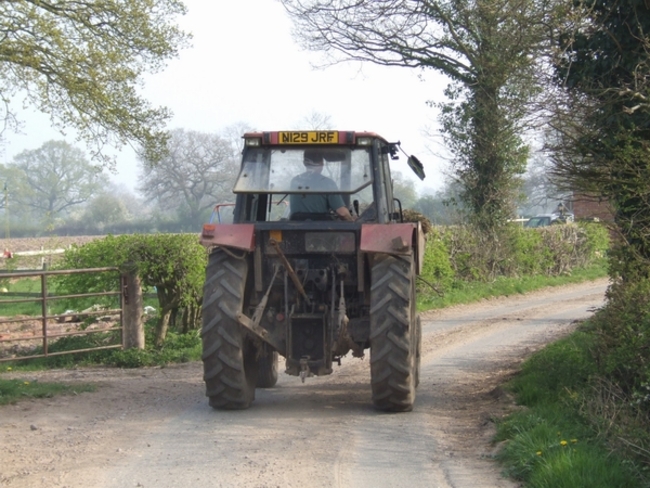 Tractor_on_the_road_from_Shredicote_Farm_-_geograph.org.uk_-_400942