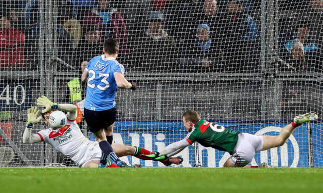 Paddy Andrews is denied by David Clarke straight after saving a penalty