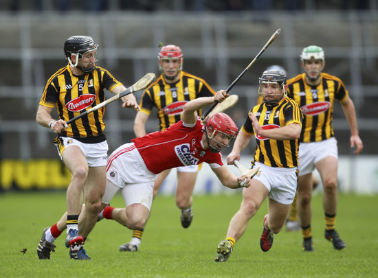 Bill Cooper is tackled by Conor Fogarty