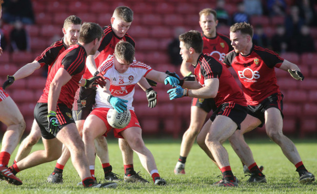 Barry Grant surrounded by Down players