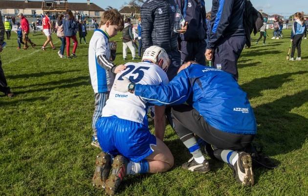 8 year old Sean Og O'Regan from Kilmacthomas comforts the injured Brian O'Halloran