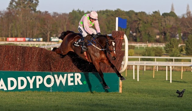 Min ridden by Ruby Walsh clears the first on the way to winning The Racing Post Novice Steeplechase