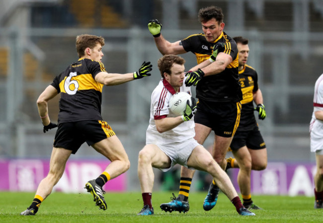 Ambrose O’Donovan and Gavin White tackle Padraig Cassidy