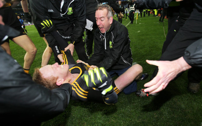 Colm Cooper celebrates with manager Pat O'Shea at the final whistle