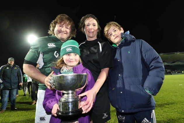 Ireland’s Shane Byrne with the Stuart Mangan Cup and Olive Foley ,Siofra Foley (daughter of Rosie Foley) and Tony Foley at the end of the match