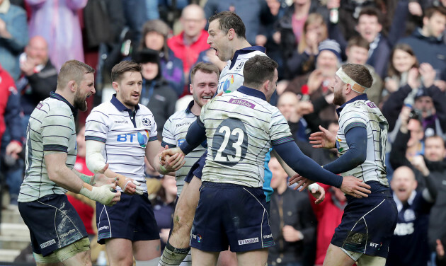 Tim Visser celebrates scoring a try with teammates