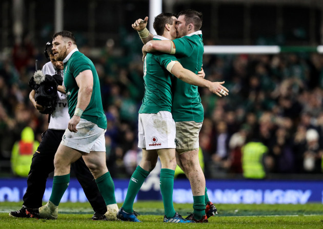 Johnny Sexton celebrates at the final whistle with Peter O'Mahony