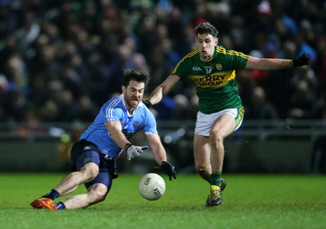 Paul Geaney tackles Michael Darragh Macauley