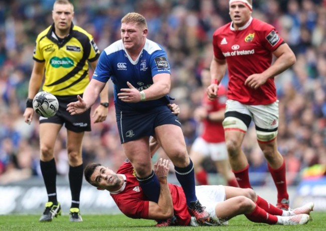 Leinster’s Tadhg Furlong is tackled by Munster’s Conor Murray